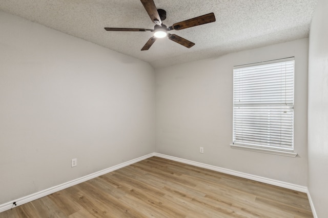 1019 Chelsea Ln, Forney, TX 75126 - unfurnished room with ceiling fan, light wood finished floors, baseboards, and a textured ceiling
