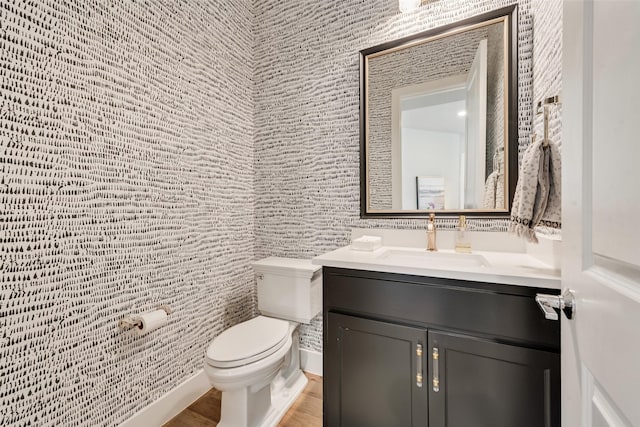 15102 Crape Myrtle Rd, Frisco, TX 75035 - bathroom with toilet, vanity, wood finished floors, and tile walls