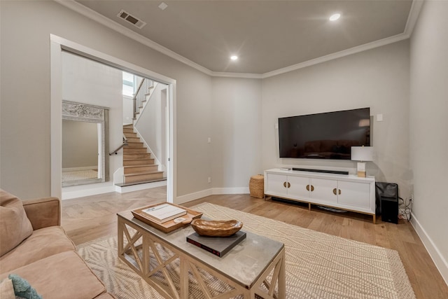 15102 Crape Myrtle Rd, Frisco, TX 75035 - living area with stairway, ornamental molding, recessed lighting, light wood-type flooring, and baseboards