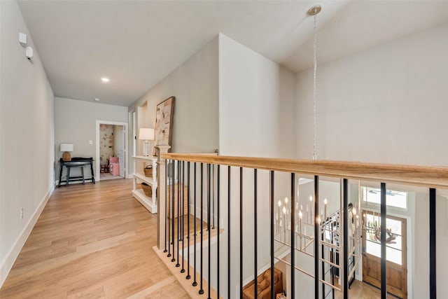 15102 Crape Myrtle Rd, Frisco, TX 75035 - corridor with an upstairs landing, wood finished floors, and baseboards