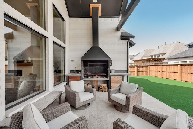 15102 Crape Myrtle Rd, Frisco, TX 75035 - fenced backyard featuring a sink and an outdoor living space with a fireplace