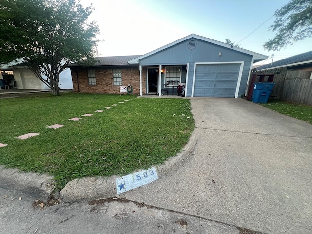 503 Cates Dr, Kaufman, TX 75142 - ranch-style house featuring driveway, a garage, and brick siding