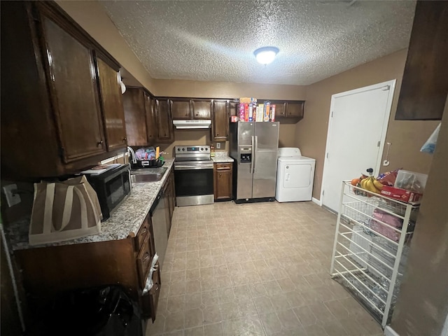 503 Cates Dr, Kaufman, TX 75142 - kitchen with washer / dryer, appliances with stainless steel finishes, a sink, under cabinet range hood, and dark brown cabinetry