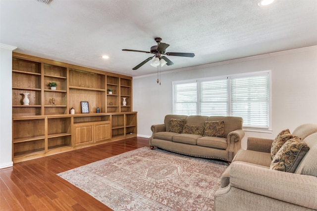 living area featuring ornamental molding, ceiling fan, wood finished floors, recessed lighting, and baseboards