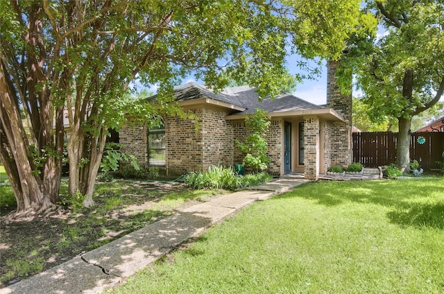 3022 Westforest Dr, Dallas, TX 75229 - view of front facade featuring brick siding and a chimney
