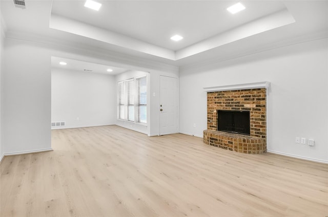 3022 Westforest Dr, Dallas, TX 75229 - unfurnished living room featuring a raised ceiling, wood finished floors, baseboards, a brick fireplace, and recessed lighting