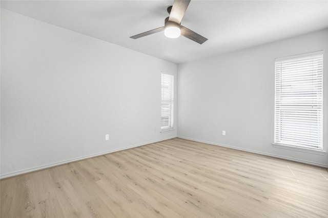 3022 Westforest Dr, Dallas, TX 75229 - empty room featuring light wood-type flooring, ceiling fan, and healthy amount of natural light