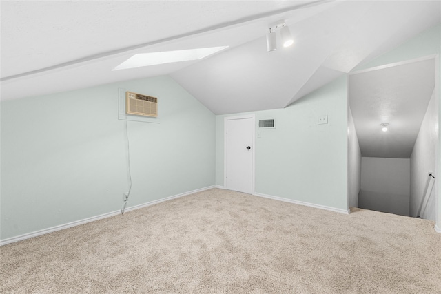 3022 Westforest Dr, Dallas, TX 75229 - bonus room with lofted ceiling, a skylight, carpet floors, baseboards, and a wall mounted AC