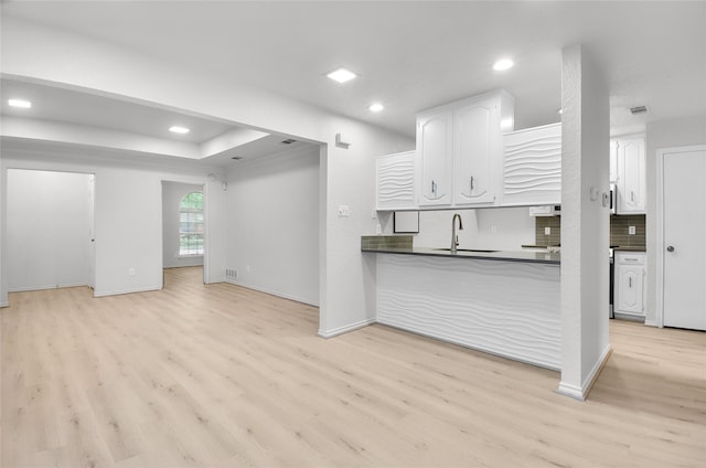 3022 Westforest Dr, Dallas, TX 75229 - unfurnished living room with a sink, light wood-style flooring, recessed lighting, and baseboards