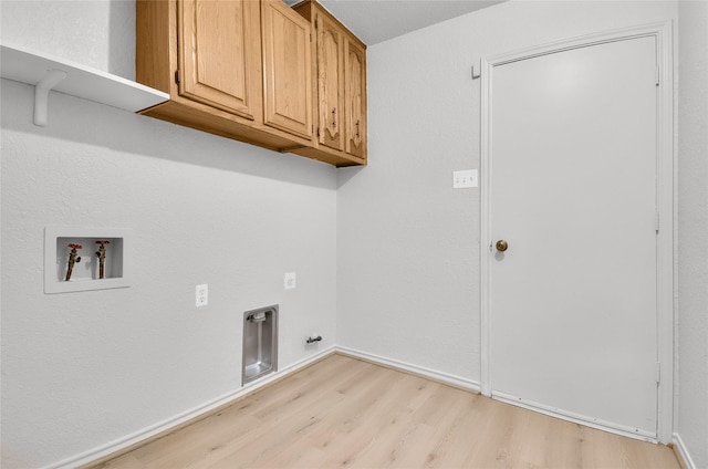 3022 Westforest Dr, Dallas, TX 75229 - laundry room with hookup for a washing machine, light wood-style flooring, cabinet space, electric dryer hookup, and baseboards