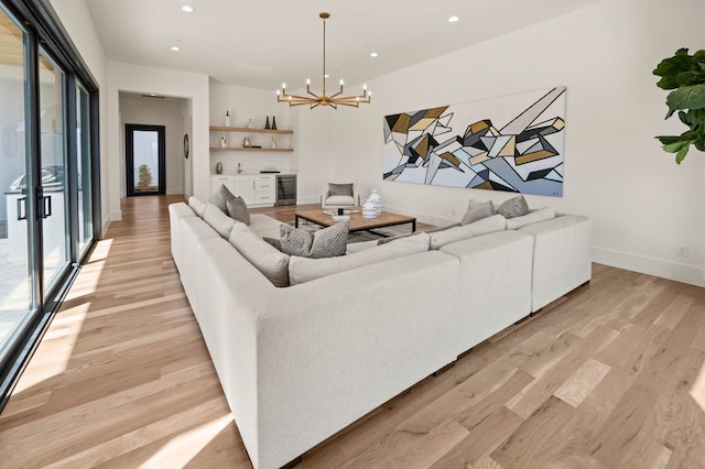 7115 Cast Iron Forest Trl, Colleyville, TX 76034 - living room with recessed lighting, wine cooler, light wood-type flooring, a chandelier, and baseboards