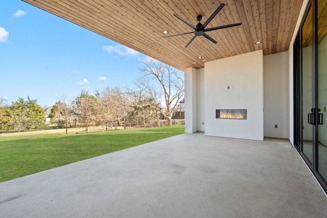7115 Cast Iron Forest Trl, Colleyville, TX 76034 - view of patio / terrace featuring a ceiling fan and a glass covered fireplace