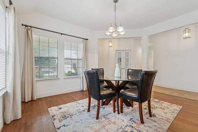 2912 Montalbo, Grand Prairie, TX 75054 - dining room with a chandelier, wood finished floors, french doors, and vaulted ceiling