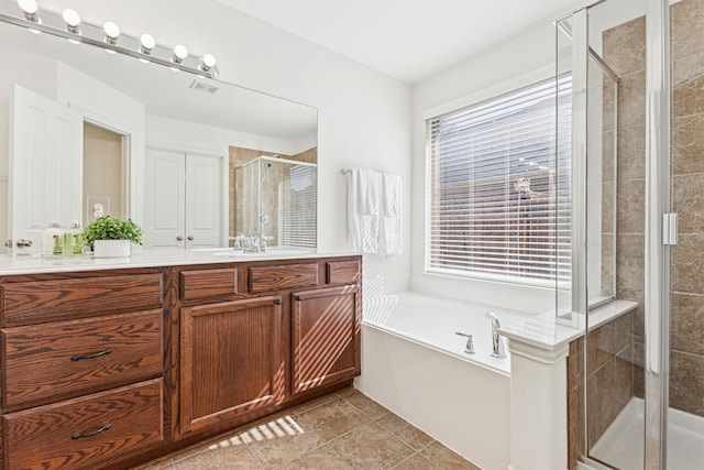 2912 Montalbo, Grand Prairie, TX 75054 - bathroom with vanity, a shower stall, and a garden tub