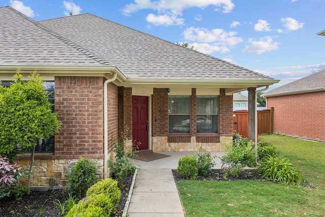 2912 Montalbo, Grand Prairie, TX 75054 - entrance to property featuring a shingled roof, brick siding, a porch, and stone siding