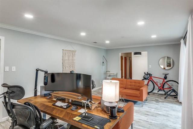 office area with crown molding, light wood-style flooring, recessed lighting, and baseboards