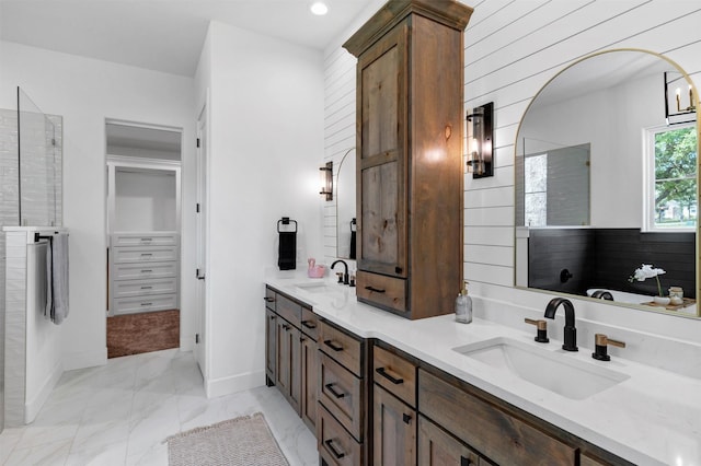 9001 Emma Ct, Granbury, TX 76049 - bathroom featuring marble look tile flooring, double vanity, a tile shower, and baseboards