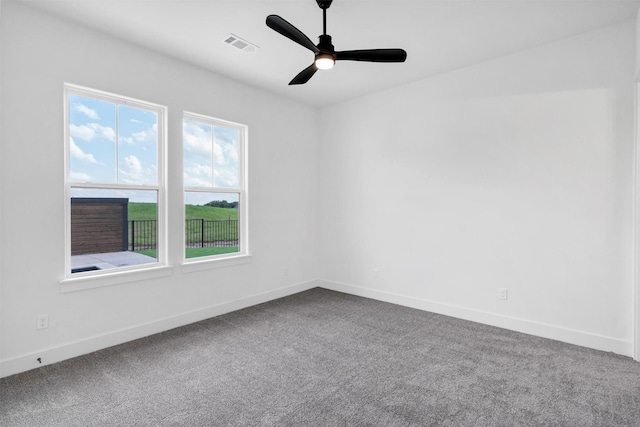9001 Emma Ct, Granbury, TX 76049 - spare room featuring dark carpet, baseboards, and a ceiling fan