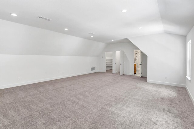 9001 Emma Ct, Granbury, TX 76049 - additional living space featuring vaulted ceiling, baseboards, light colored carpet, and recessed lighting