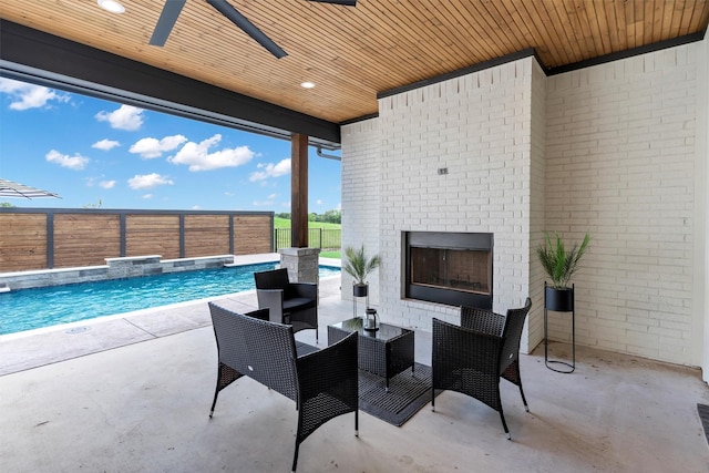 9001 Emma Ct, Granbury, TX 76049 - view of patio featuring an outdoor brick fireplace, ceiling fan, and a fenced backyard