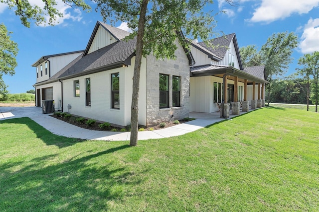 9001 Emma Ct, Granbury, TX 76049 - view of home's exterior with board and batten siding, a lawn, central air condition unit, and a shingled roof