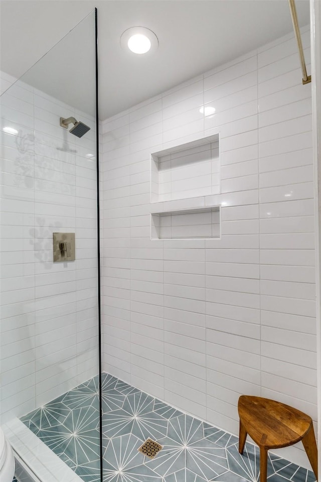 4229 Cole Ave Unit 115, Dallas, TX 75205 - full bathroom with tiled shower, toilet, and tile patterned floors