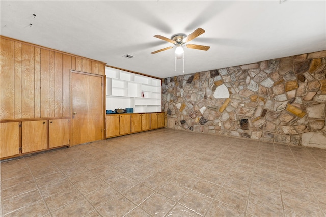 4325 Shady Glen Dr, Waco, TX 76708 - spare room with a ceiling fan and wooden walls
