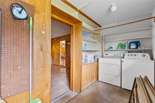 4325 Shady Glen Dr, Waco, TX 76708 - clothes washing area featuring washing machine and clothes dryer and wooden walls