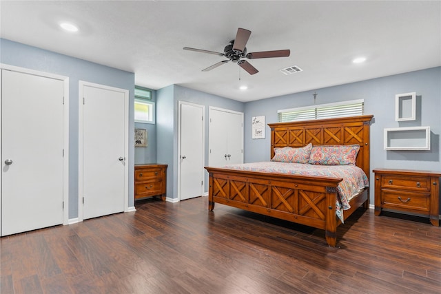 4325 Shady Glen Dr, Waco, TX 76708 - bedroom featuring wood finished floors, multiple windows, baseboards, recessed lighting, and two closets