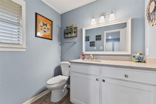 4325 Shady Glen Dr, Waco, TX 76708 - half bath featuring a textured wall, wood finished floors, toilet, vanity, and crown molding