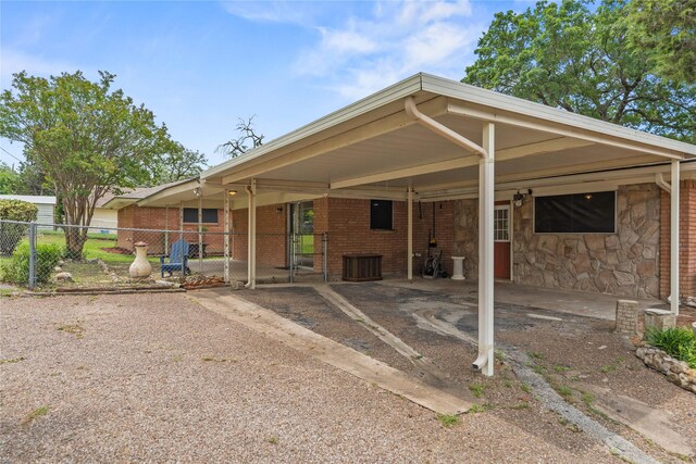 4325 Shady Glen Dr, Waco, TX 76708 - rear view of house with fence, an attached carport, cooling unit, a gate, and driveway