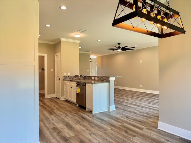 2004 Clay St, Mabank, TX 75147 - kitchen with dishwasher, crown molding, recessed lighting, dark stone countertops, and white cabinets
