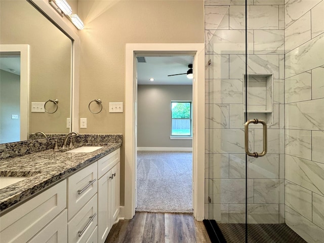 2004 Clay St, Mabank, TX 75147 - bathroom featuring wood finished floors, a stall shower, ceiling fan, vanity, and baseboards