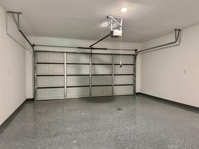 2004 Clay St, Mabank, TX 75147 - garage featuring a garage door opener and baseboards