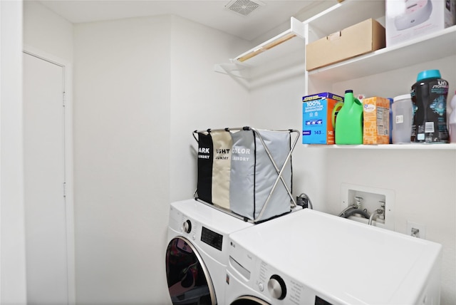 laundry area with washing machine and dryer