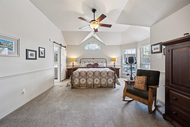 1608 Fallingwater Trl, Fort Worth, TX 76052 - carpeted bedroom featuring a barn door, multiple windows, vaulted ceiling, baseboards, and a ceiling fan