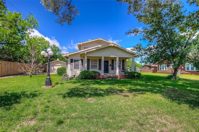 1005 Church St, Sulphur Springs, TX 75482 - view of front facade featuring covered porch, an outbuilding, and a garage