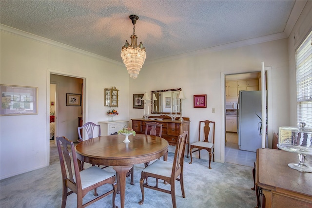 1005 Church St, Sulphur Springs, TX 75482 - dining room featuring light carpet, a chandelier, ornamental molding, and a textured ceiling