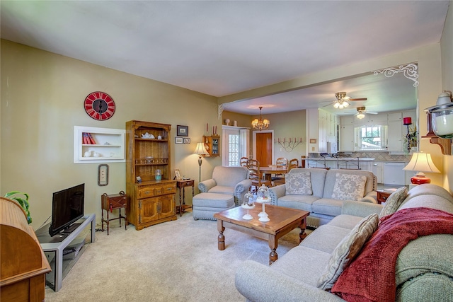 1005 Church St, Sulphur Springs, TX 75482 - living room featuring a chandelier, light colored carpet, and ceiling fan