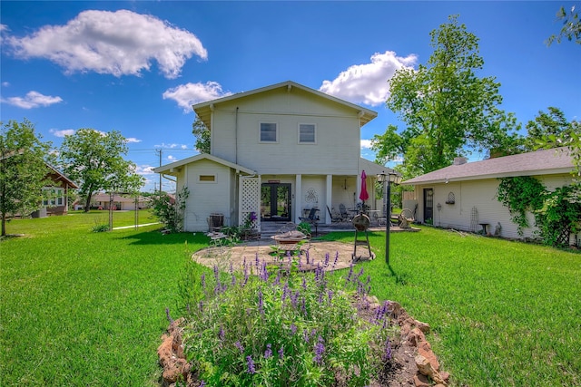 1005 Church St, Sulphur Springs, TX 75482 - back of house featuring a patio area, a yard, and central AC unit