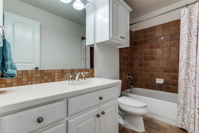 bathroom with backsplash, vanity, shower / tub combo, and toilet