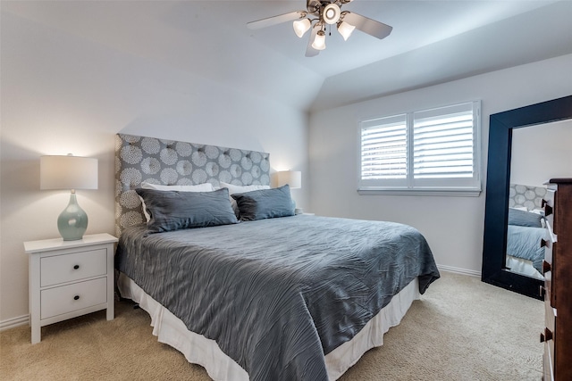 bedroom with light colored carpet, baseboards, and ceiling fan