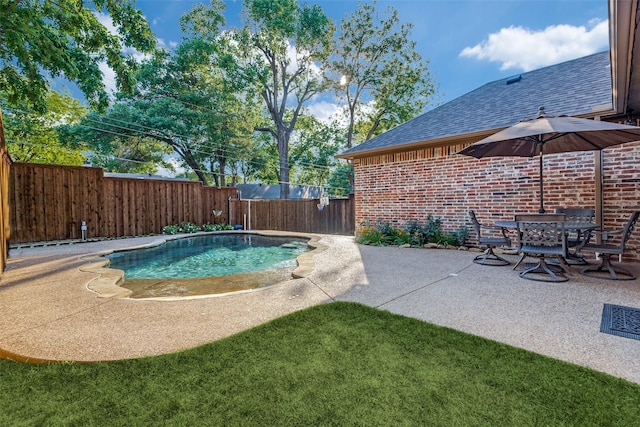 view of swimming pool featuring a fenced backyard and a patio area
