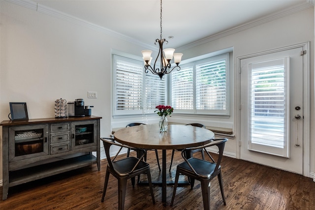 dining room featuring a chandelier, dark wood-style floors, and ornamental molding