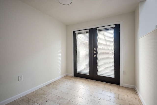 6808 Eastridge Dr Unit A7, Dallas, TX 75231 - empty room featuring french doors, baseboards, and light tile patterned flooring