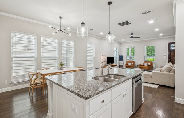 719 Hammond St, Coppell, TX 75019 - kitchen featuring a sink, crown molding, stainless steel dishwasher, open floor plan, and dark wood-style floors