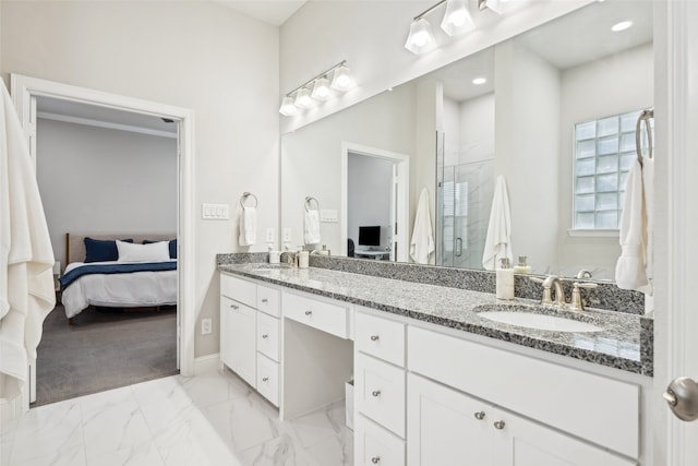 719 Hammond St, Coppell, TX 75019 - full bath with ensuite bath, a shower stall, baseboards, double vanity, and marble look tiles