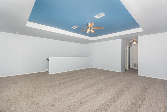 additional living space with a ceiling fan, carpet floors, and baseboards