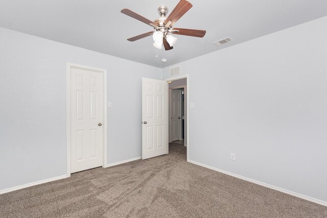 unfurnished bedroom with carpet flooring, baseboards, and a ceiling fan