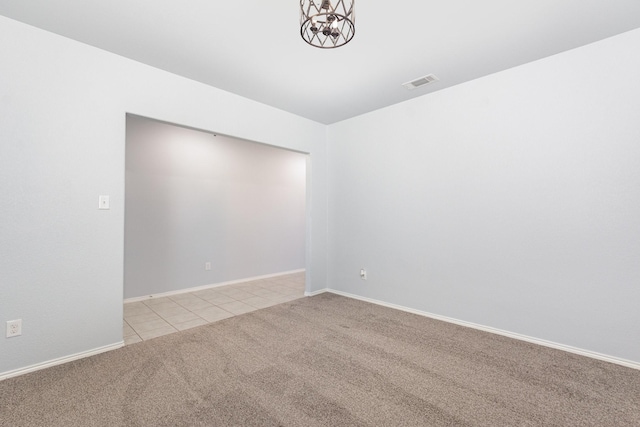 2217 Heaton St, Forney, TX 75126 - spare room with light carpet, a chandelier, light tile patterned floors, and baseboards